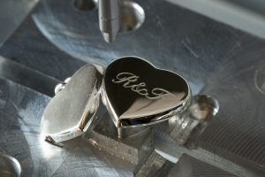 personalised locket in engraving machine