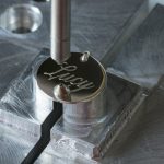 Silver-necklace-being-engraved