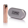 engraved rose gold clipper lighter beside tin